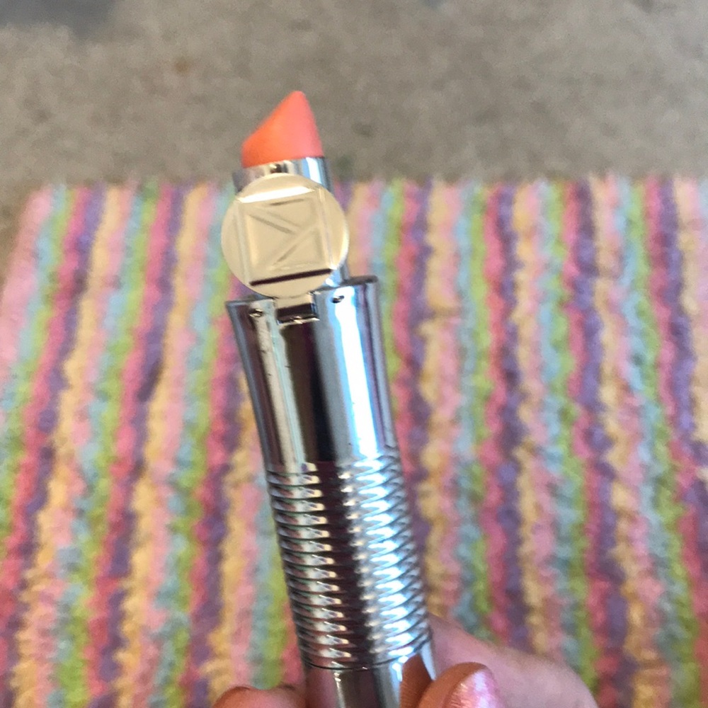 A coral lip shimmer never used that u twist
